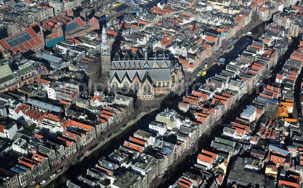 Amsterdam from above - City center with residential areas and canals channels at the church Oude Kerk in the center of Amsterdam in the Netherlands