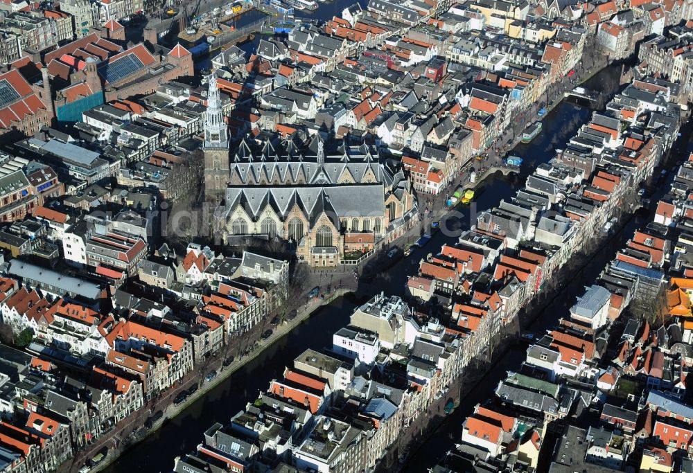 Amsterdam from the bird's eye view: City center with residential areas and canals channels at the church Oude Kerk in the center of Amsterdam in the Netherlands