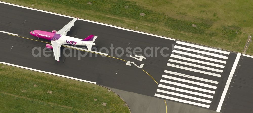 Aerial photograph Dortmund - Start of an Airbus A320 on the runway of the airport Dortmund in North Rhine-Westphalia Wickede. The Wizz Air is a 2004 founded Ukrainian air carriers