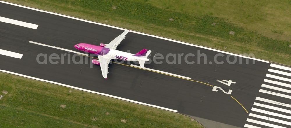 Dortmund from above - Start of an Airbus A320 on the runway of the airport Dortmund in North Rhine-Westphalia Wickede. The Wizz Air is a 2004 founded Ukrainian air carriers