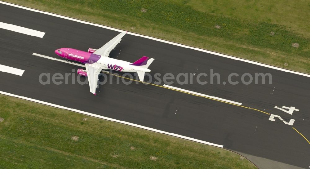 Dortmund from the bird's eye view: Start of an Airbus A320 on the runway of the airport Dortmund in North Rhine-Westphalia Wickede. The Wizz Air is a 2004 founded Ukrainian air carriers