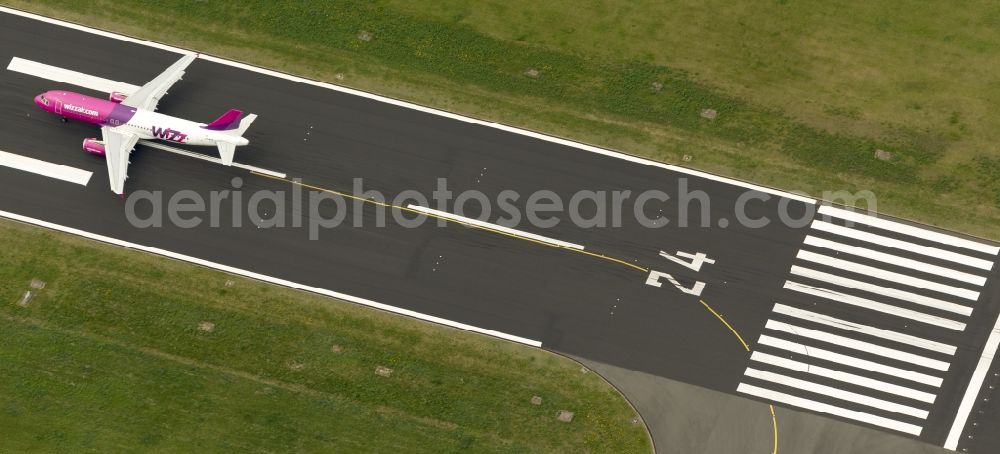 Aerial image Dortmund - Start of an Airbus A320 on the runway of the airport Dortmund in North Rhine-Westphalia Wickede. The Wizz Air is a 2004 founded Ukrainian air carriers