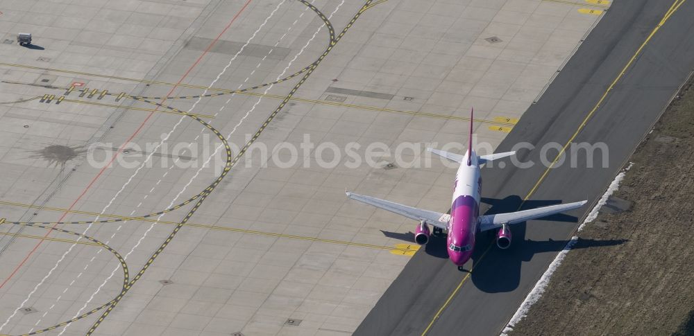 Aerial photograph Dortmund - Start of an Airbus A320 on the runway of the airport Dortmund in North Rhine-Westphalia Wickede. The Wizz Air is a 2004 founded Ukrainian air carriers