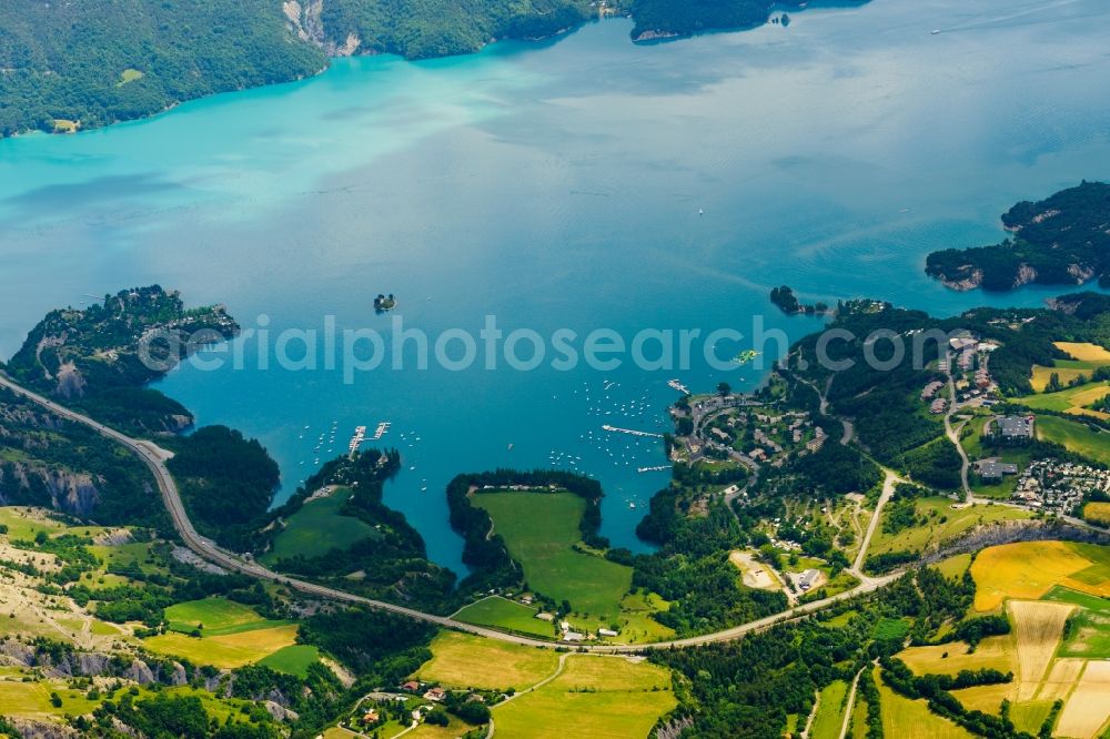 Aerial photograph Chorges - Impoundment and shore areas with habor at the lake Lac de Serre-Poncon in Chorges in Provence-Alpes-Cote d'Azur, France