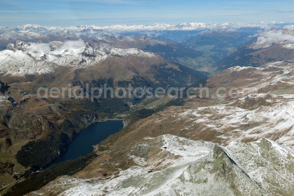 Aerial photograph Marmorera - Impoundment and shore areas at the lake in Marmorera in the canton Graubuenden, Switzerland