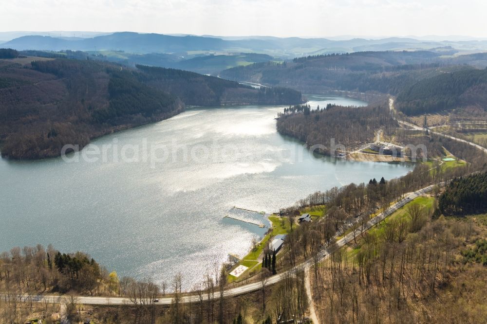 Meschede from above - Impoundment and shore areas at the lake Hennesee in Meschede in the state North Rhine-Westphalia, Germany