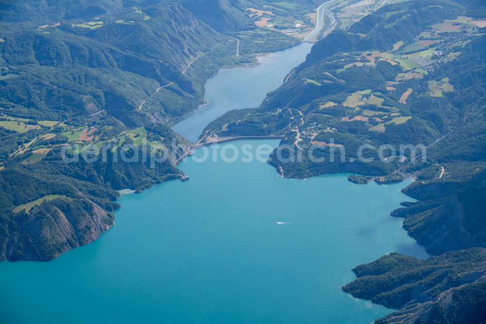 Le Sauze-du-Lac from above - Impoundment and shore areas at the lake Lac de Serre-Poncon in Le Sauze-du-Lac in Provence-Alpes-Cote d'Azur, France