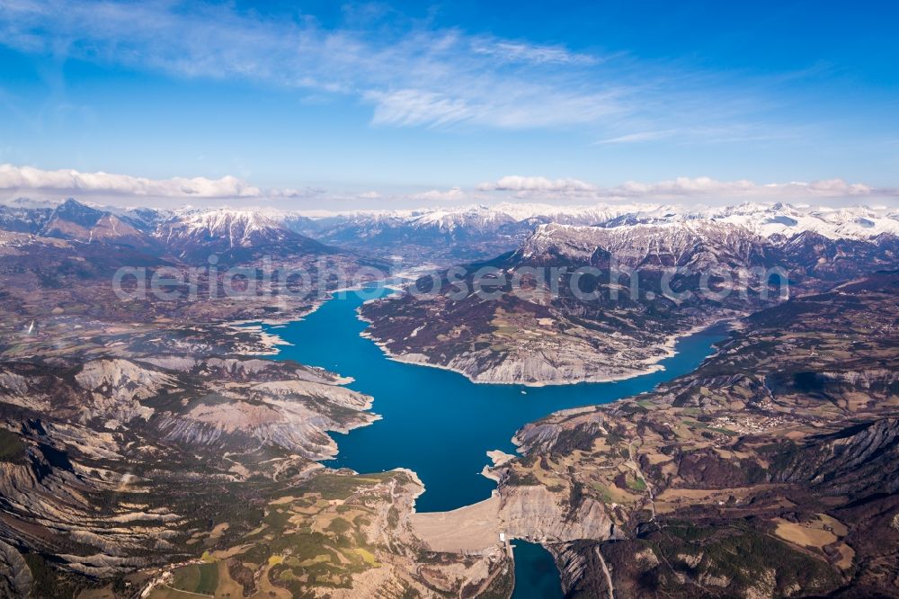 Aerial image Rousset - Dam and shore areas at the lake Lac de Serre-Poncon in Rousset in Provence-Alpes-Cote d'Azur, France. Lac de Serre-Poncon is used intensively for tourists