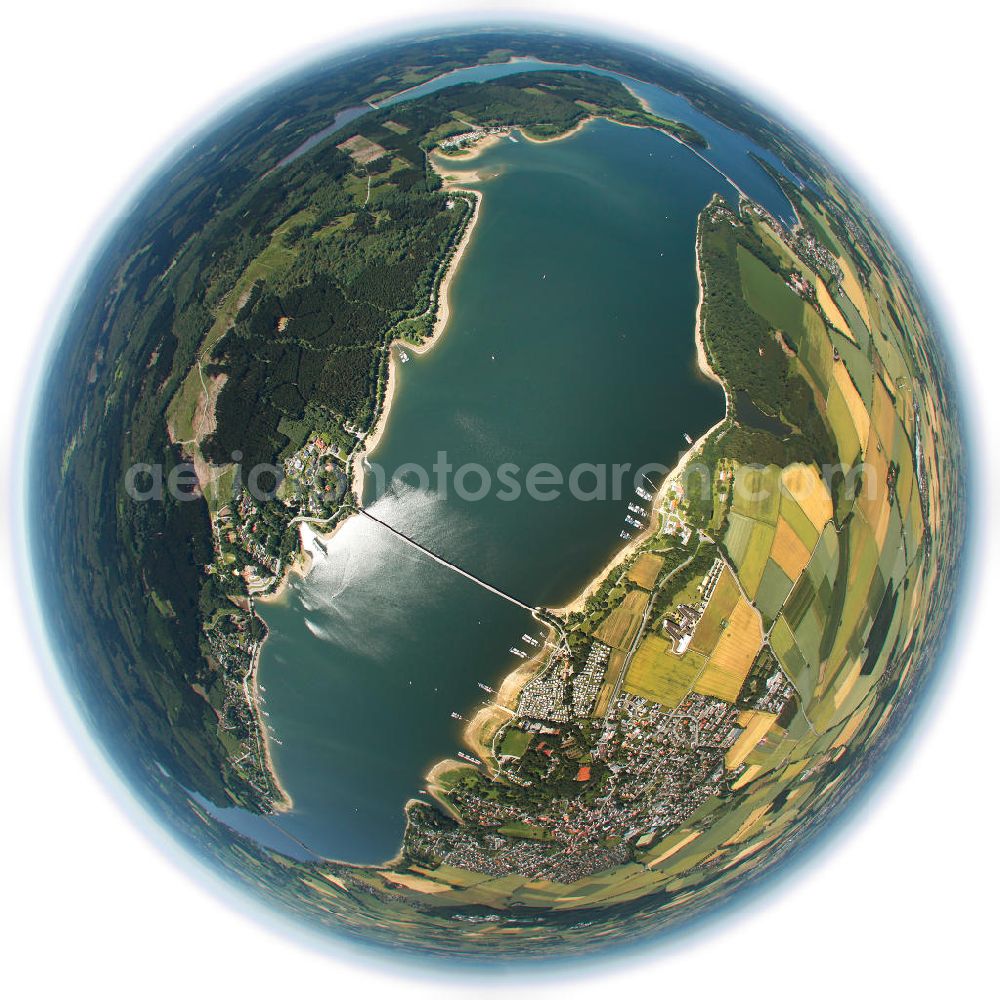 Aerial image Möhnesee - Fish Eye - Blick auf den Stausee Möhnesee in Nordrhein-Westfalen. Die Möhnetalsperre dient der Niedrigwasseraufhöhung, dem Hochwasserschutz und der Stromerzeugung aus Wasserkraft. Vorrangiges Ziel ist die Niedrigwasseraufhöhung der Ruhr, in die das Wasser der Talsperre über den Unterlauf Möhne und den Zusammenfluss in Neheim (Stadt Arnsberg) gelangt. Fish Eye view of Reservoir Möhnesee in North Rhine-Westphalia.