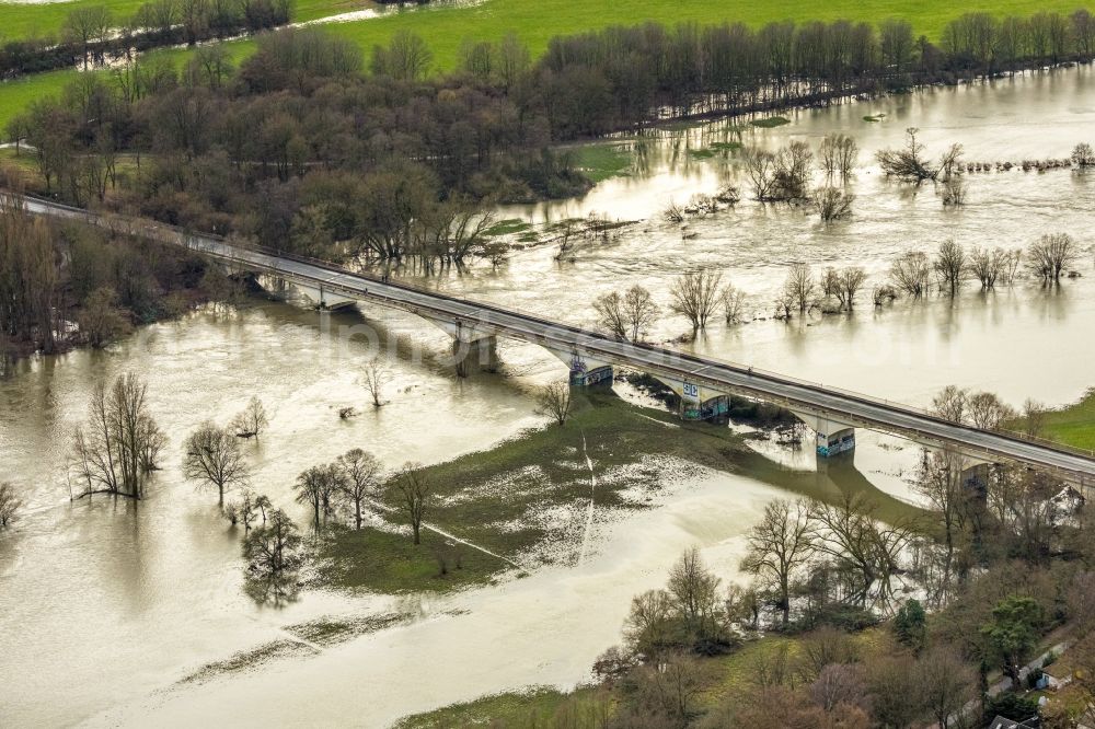 Bochum from above - Weir on the banks of the flux flow Ruhr during the flood disaster with brown water masses in Bochum at Ruhrgebiet in the state North Rhine-Westphalia, Germany