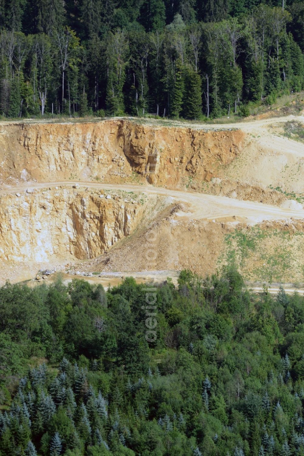 Aerial photograph Iggenhausen - Mining pit and quarry in a forest in the North of Iggenhausen in the state of Baden-Wuerttemberg