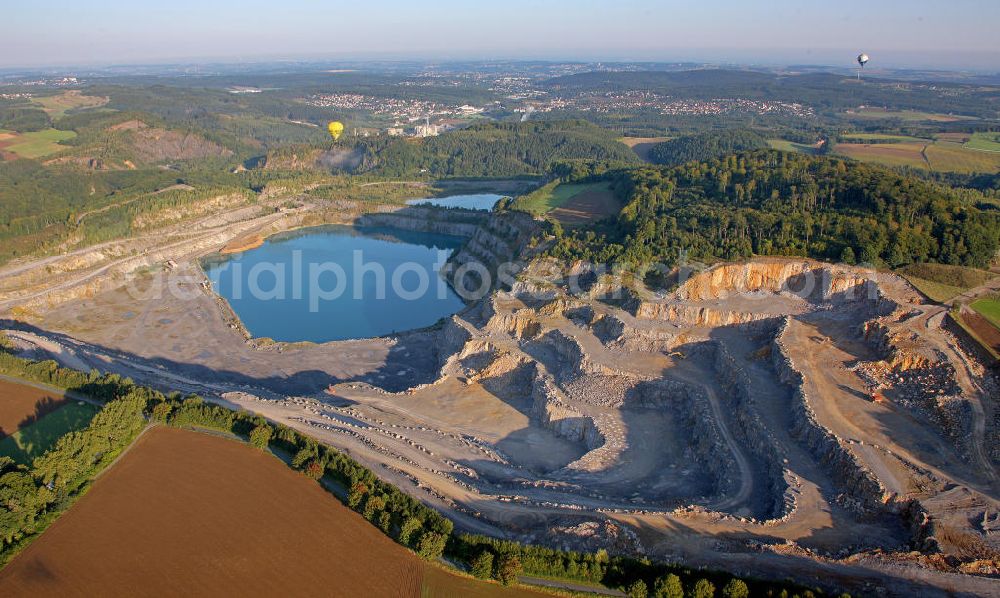 Asbeck from the bird's eye view: Blick auf den Steinbruch Horst mit Klärbecken bei Asbeck. Hier wird Kalk abgebaut. View of the quarry Horst with sedimentation tank near Asbeck.