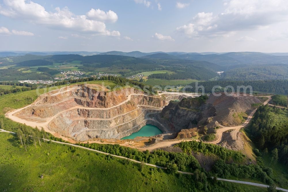 Aerial image Brilon Rösenbeck - Stone quarry with quarry lake in the district Roesenbeck in Brilon in North Rhine-Westphalia. Operator is the Bernhard Muehlenbein GmbH & Co. KG