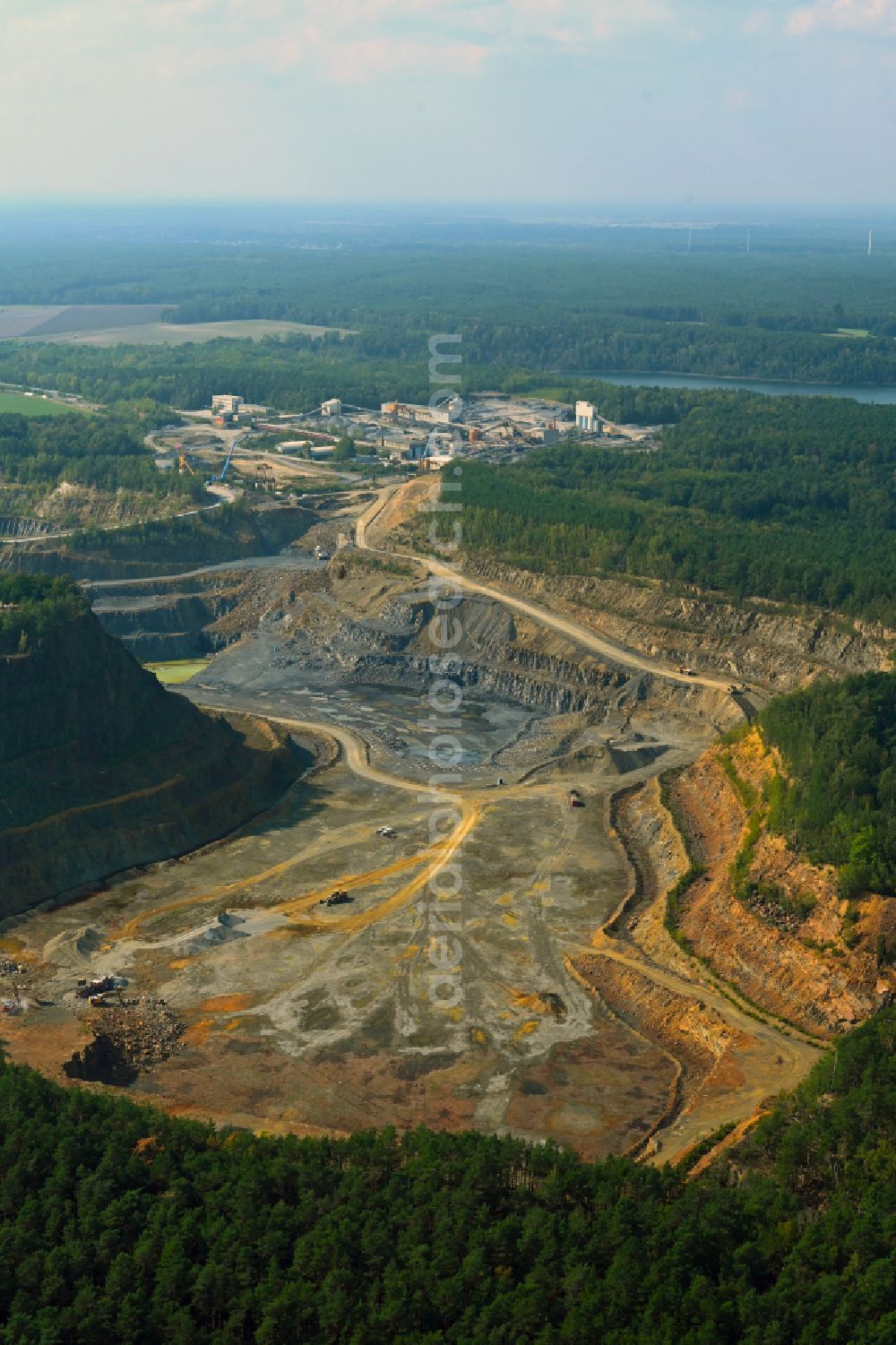 Oßling from the bird's eye view: Quarry for the extraction and mining of greywacke in the Grauwackebruch Lieske in Ossling in the federal state of Saxony, Germany