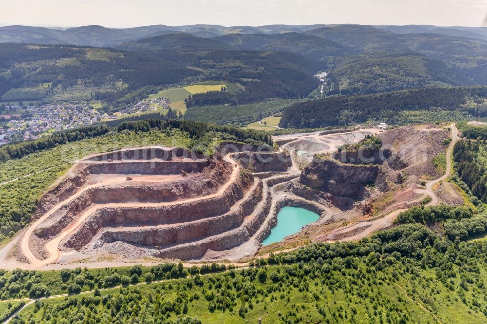 Brilon from the bird's eye view: Quarry for the mining and handling of Grauwacke of Westdeutschen Grauwacke Union GmbH in Brilon in the state North Rhine-Westphalia, Germany