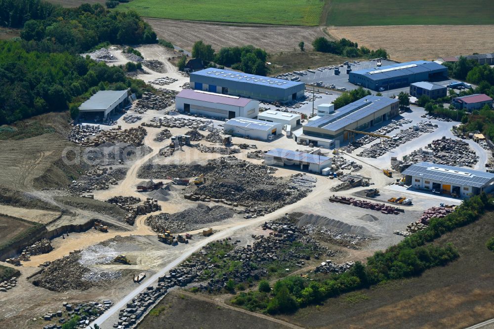 Aerial image Kleinrinderfeld - Quarry for the mining and handling of Muschelkalk on street Maisenbacher Strasse in Kleinrinderfeld in the state Bavaria, Germany