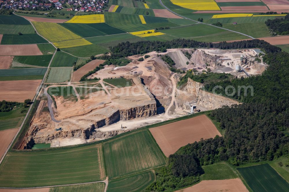 Aerial image Karlstadt - Quarry for the mining and handling of gravel of the Emil Vaeth GmbH Schotterwerk and Bauschuttrecycling Am Schotterwerk in Karlstadt in the state Bavaria, Germany