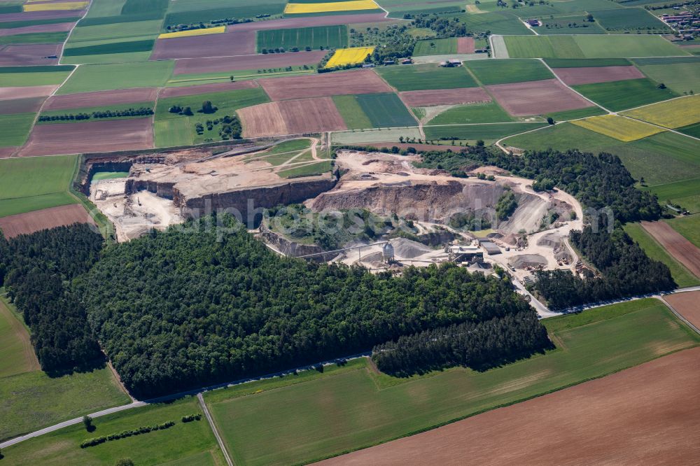 Karlstadt from above - Quarry for the mining and handling of gravel of the Emil Vaeth GmbH Schotterwerk and Bauschuttrecycling Am Schotterwerk in Karlstadt in the state Bavaria, Germany