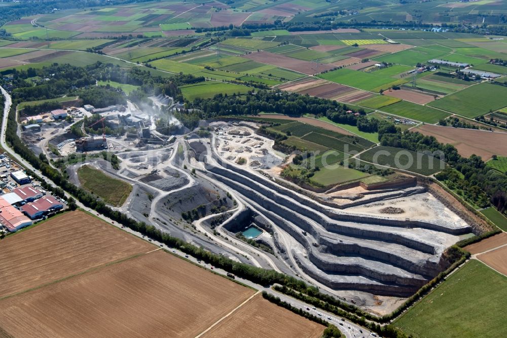 Aerial photograph Talheim - Quarry for the mining and handling of gravel and sledges overlooking the construction site to build a new gravel plant in Talheim in the state Baden-Wurttemberg, Germany