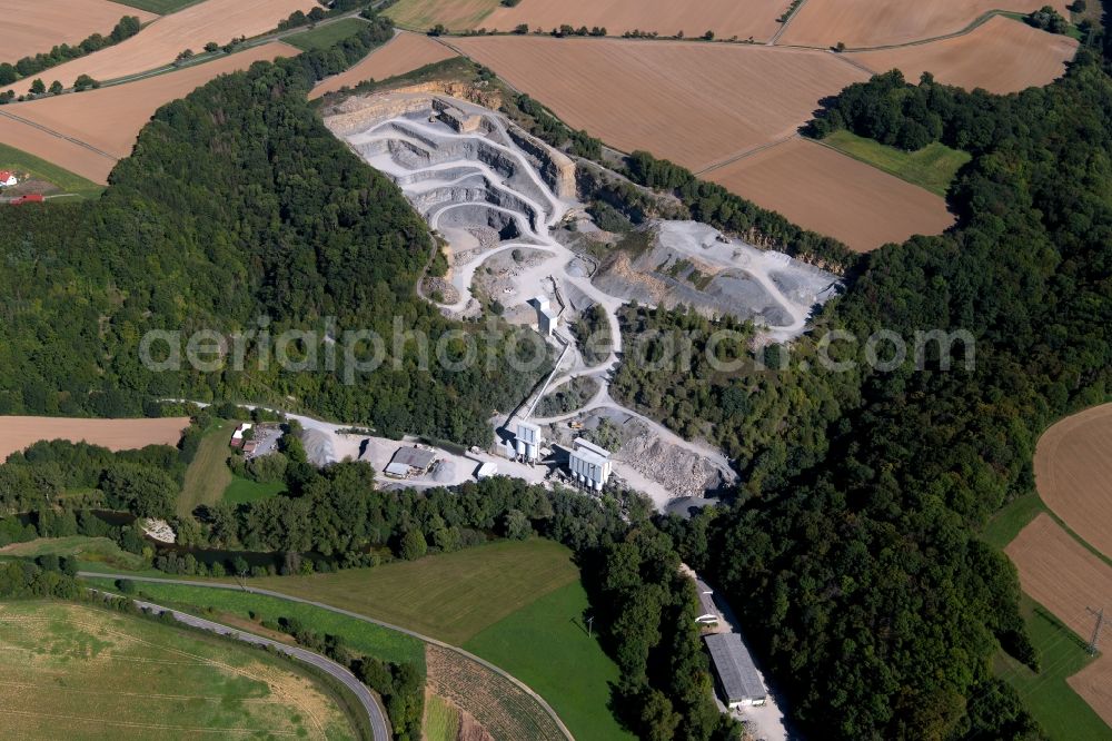 Schöntal from above - Quarry for the mining and handling of gravel, shell limestone, granite in Schoental in the state Baden-Wurttemberg, Germany