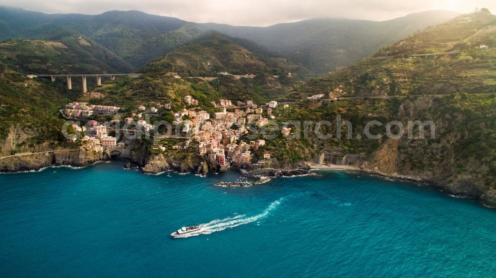 Aerial image Riomaggiore - Stony beach landscape on the coast the Mediterranean sea in Riomaggiore in Liguria, Italy