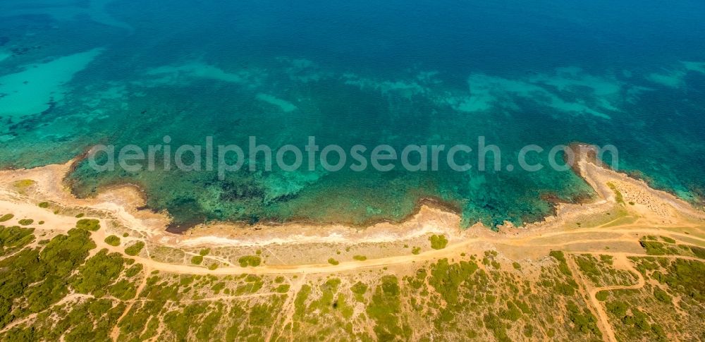 Aerial image Son Sierra de Marina - Stony beach landscape on the coast with Obelisk and tower- remains of Marine in Son Sierra de Marina in Balearic Islands, Spain