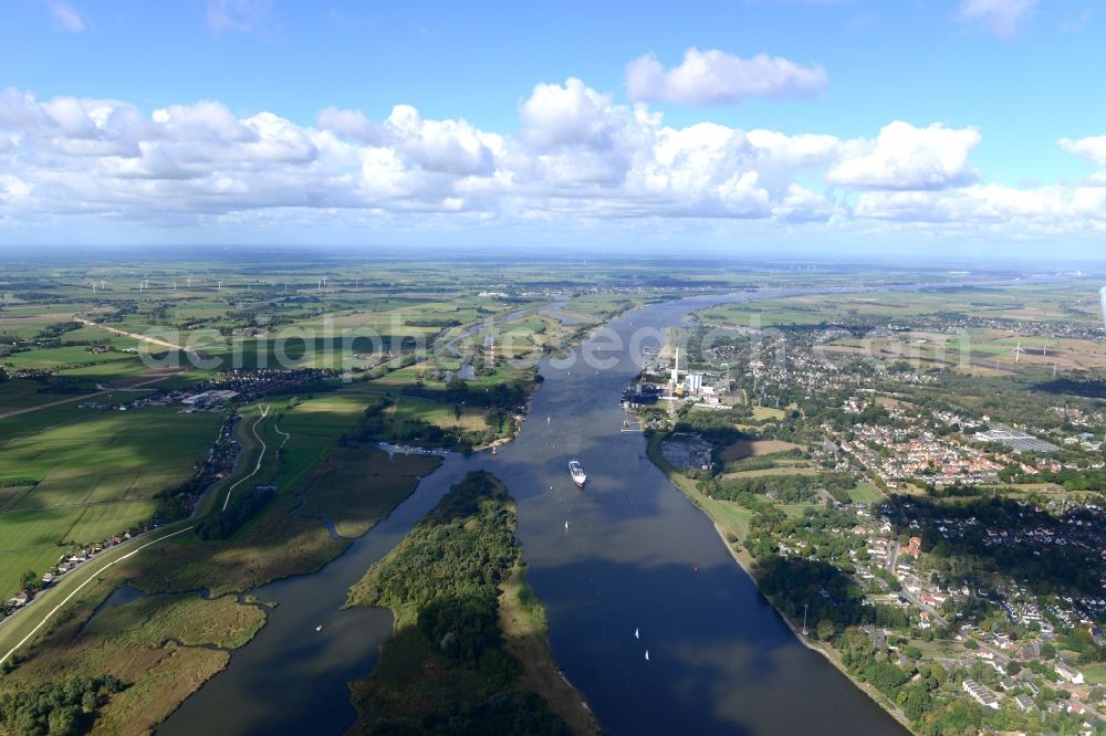 Bremen from the bird's eye view: Coal power plant Farge of the Engie-Group on the riverbank of the Weser in Bremen in Germany. The course of the river is visible as well as a freight ship