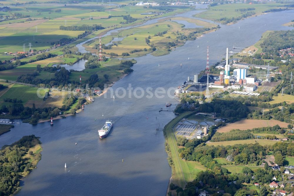 Aerial image Bremen - Coal power plant Farge of the Engie-Group on the riverbank of the Weser in Bremen in Germany. The course of the river is visible as well as a freight ship