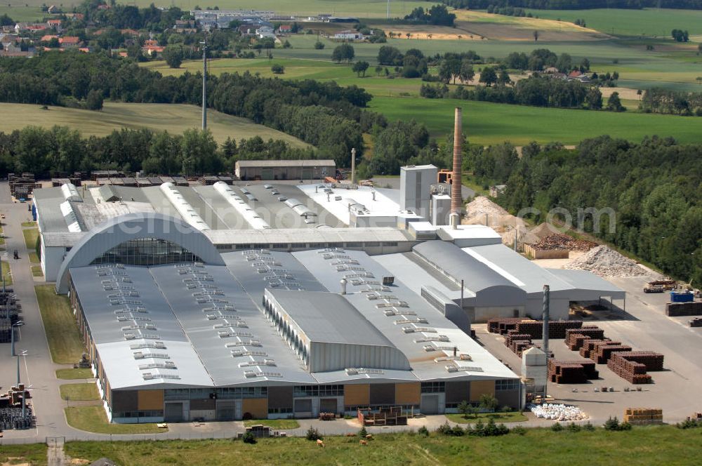 Bad Schmiedeberg from the bird's eye view: Blick auf das Werk der Firma STEINZEUG Abwassersysteme GmbH im Stadtteil Patzschwig. Die STEINZEUG GmbH ist Hersteller von Steinzeugrohren und Formstücken. Weitere Produktionsstandorte sind Frechen in Nordrhein-Westfalen und Hasselt in Belgien. Kontakt: STEINZEUG Abwassersysteme GmbH, Verlängerte Torgauer Straße 1, 06905 Bad Schmiedeberg, Tel. +49(0)2234 5070, Fax +49(0)2234 507730