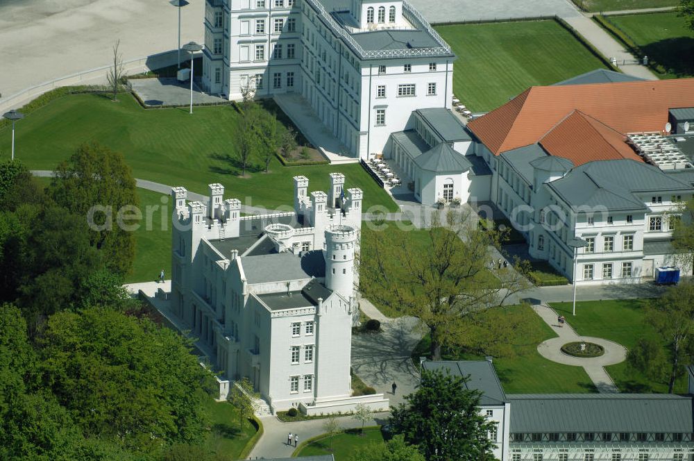 Bad Doberan - Heiligendamm from the bird's eye view: Blick auf die Burg Hohenzollern vom Kempinski Grand Hotel Heiligendamm. Im Hintergrund das Haus Mecklenburg und das Kurhaus. Mit der Burg Hohenzollern hatte einst Großherzog Paul Friedrich sich und seiner Gemahlin einen Traum erfüllt. Heute residiert man unter Zinnen und Giebeln in 12 luxuriösen Doppelzimmer und 9 Suiten. Kontakt: Prof.-Dr.-Vogel-Straße 16-18, 18209 Bad Doberan - Heiligendamm, Tel. +49 (0) 38203 740-0, Fax: +49 (0) 38203 740-7474, E-mail: reservations.heiligendamm@kempinski.com