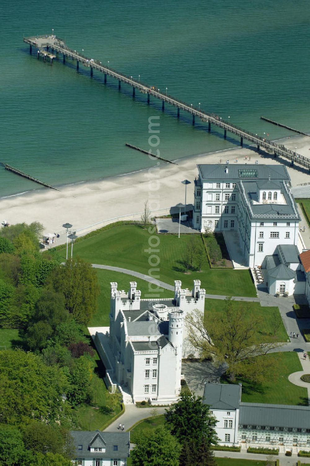 Aerial photograph Bad Doberan - Heiligendamm - Blick auf die Burg Hohenzollern vom Kempinski Grand Hotel Heiligendamm. Im Hintergrund das Haus Mecklenburg. Mit der Burg Hohenzollern hatte einst Großherzog Paul Friedrich sich und seiner Gemahlin einen Traum erfüllt. Heute residiert man unter Zinnen und Giebeln in 12 luxuriösen Doppelzimmer und 9 Suiten. Kontakt: Prof.-Dr.-Vogel-Straße 16-18, 18209 Bad Doberan - Heiligendamm, Tel. +49 (0) 38203 740-0, Fax: +49 (0) 38203 740-7474, E-mail: reservations.??????????????????????????