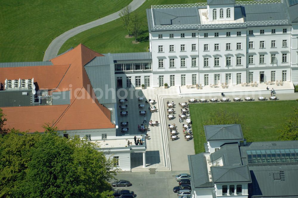 Bad Doberan - Heiligendamm from the bird's eye view: Blick auf die Terasse am Haus Mecklenburg und Kurhaus vom Kempinski Grand Hotel Heiligendamm. Das Haus Mecklenburg umfasst 35 luxuriösen Doppelzimmer und 17 Suiten. Das Haus Mecklenburg erreicht man vom Kurhaus durch einen Wandelgang. Das Kurhaus ist der Mittelpunkt der Hotelanlage mit einem Ballsaal und Restaurant. Kontakt: Prof.-Dr.-Vogel-Straße 16-18, 18209 Bad Doberan - Heiligendamm, Tel. +49 (0) 38203 740-0, Fax: +49 (0) 38203 740-7474, E-mail: reservations.he?????????????????????????