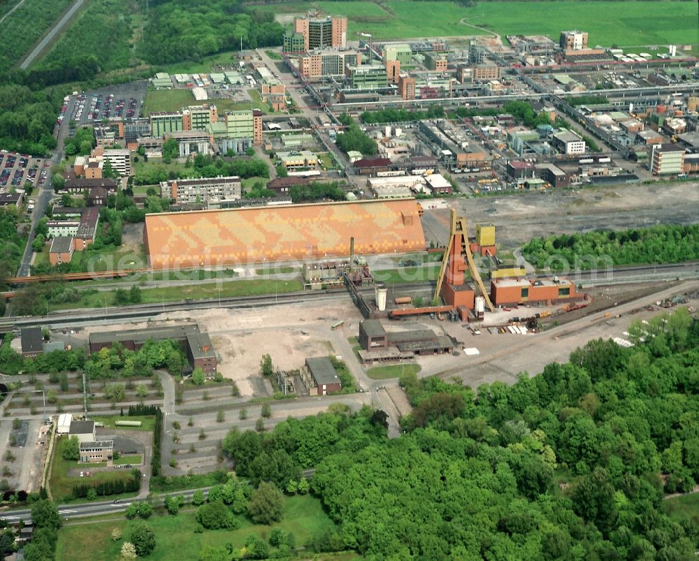 Bergkamen from the bird's eye view: View at the disused coal mine pit Monopol Grimberg1/2 in Bergkamen in the federal state of North Rhine-Westphalia. On the site today are several recycling companies located. The pit 2 is monument protected