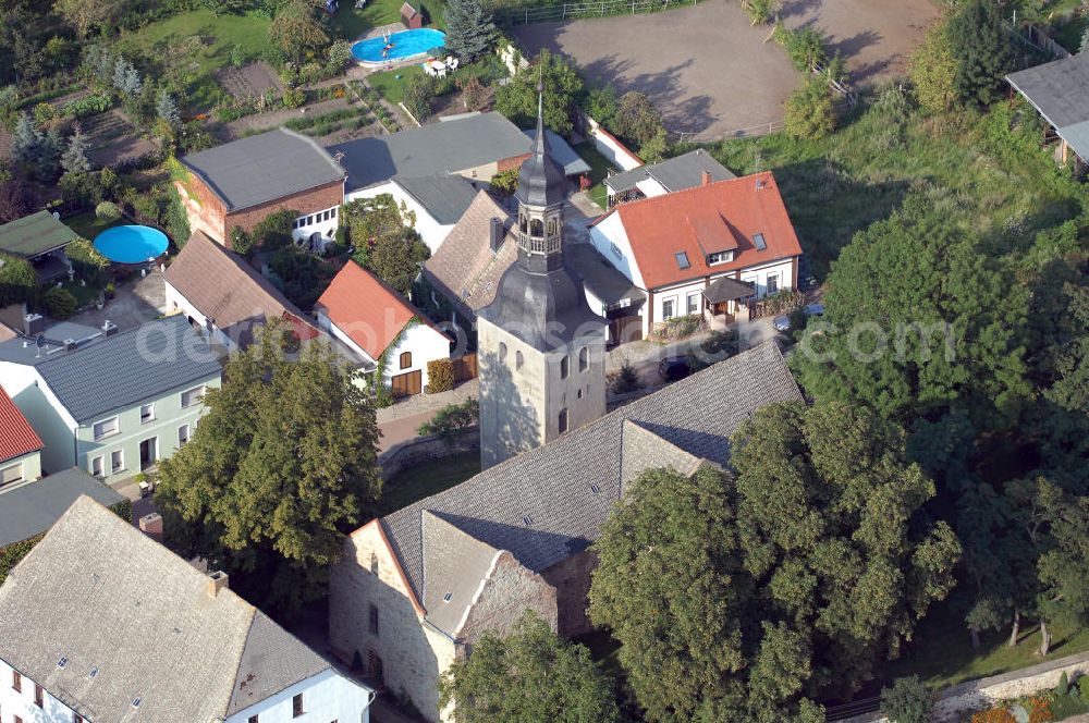 Aerial image Leitzkau - Strasse der Romanik: In das Jahr 1107 gehen die Ursprünge der Kirche St. Petri zurück. Vom Brandenburger Bischof Harbert wurde sie als hölzerne Kapelle gegründet und 1114 durch einen Steinbau ersetzt. Dieser interessante romanische Bau gehört zu den ersten sakralen Steinbauten dieser Gegend. Leitzkau 2007/08/07 Strasse der Romanik: The origins of St Petri church date back to 1107. It was founded as a wooden chapel by bishop Harbert of Brandenburg, and replaced in 1114 by a stone structure. This interesting Romanesque building is one of the first religious buildings in the region.