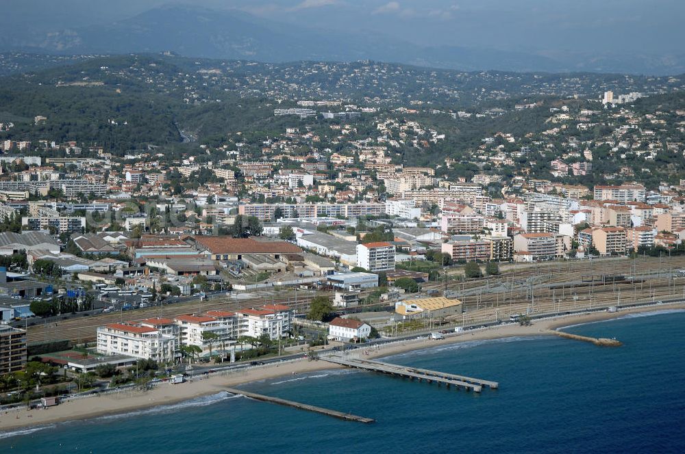 Aerial image Cannes - Blick auf den Strand von Canne Las Bocca mit Gewerbegebiet und im Hintergrund den Alpen. Mit im Bild ist das erst vor kurzem fertiggestellte Hotel Le Royal Palm Residence am Boulevard De Midi im Stadtteil Las Bocca von Cannes. Kontakt Touristinfo: Office du Tourisme, BP 272, 06403 Cannes Cedex, Tel. +33(0)492 99842 2, Fax +33(0)492 99842 3, Email: tourisme@semec.com