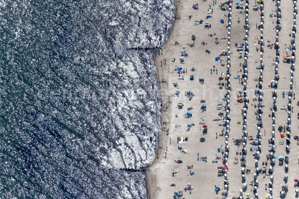 Grömitz from the bird's eye view: Beach chair on the sandy beach ranks in the coastal area in Groemitz in the state Schleswig-Holstein, Germany