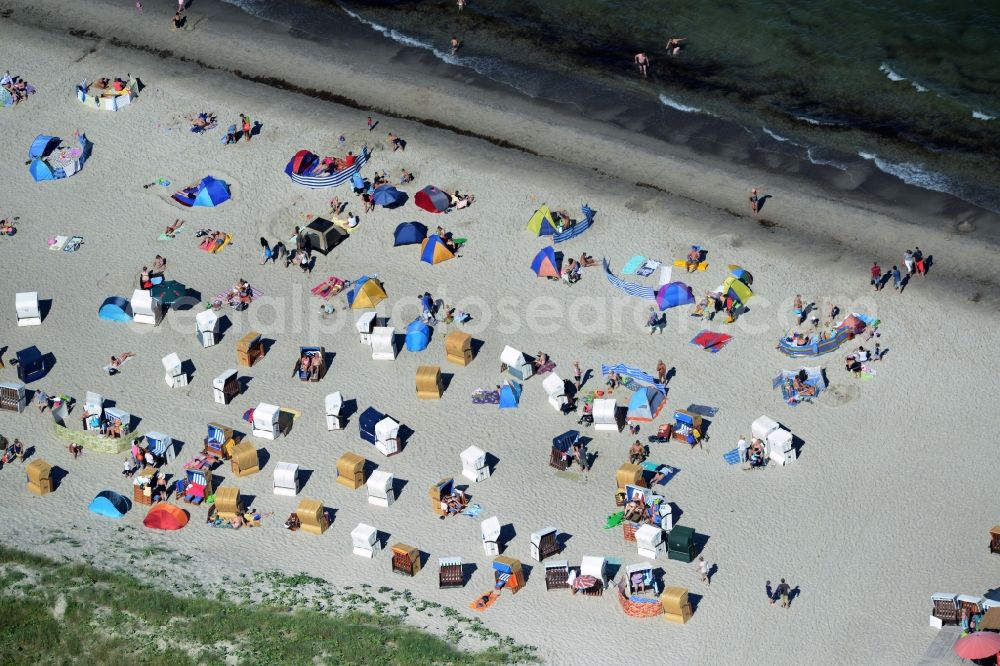 Dierhagen from the bird's eye view: Beach chair on the sandy beach ranks in the coastal area of baltic see in Dierhagen in the state Mecklenburg - Western Pomerania