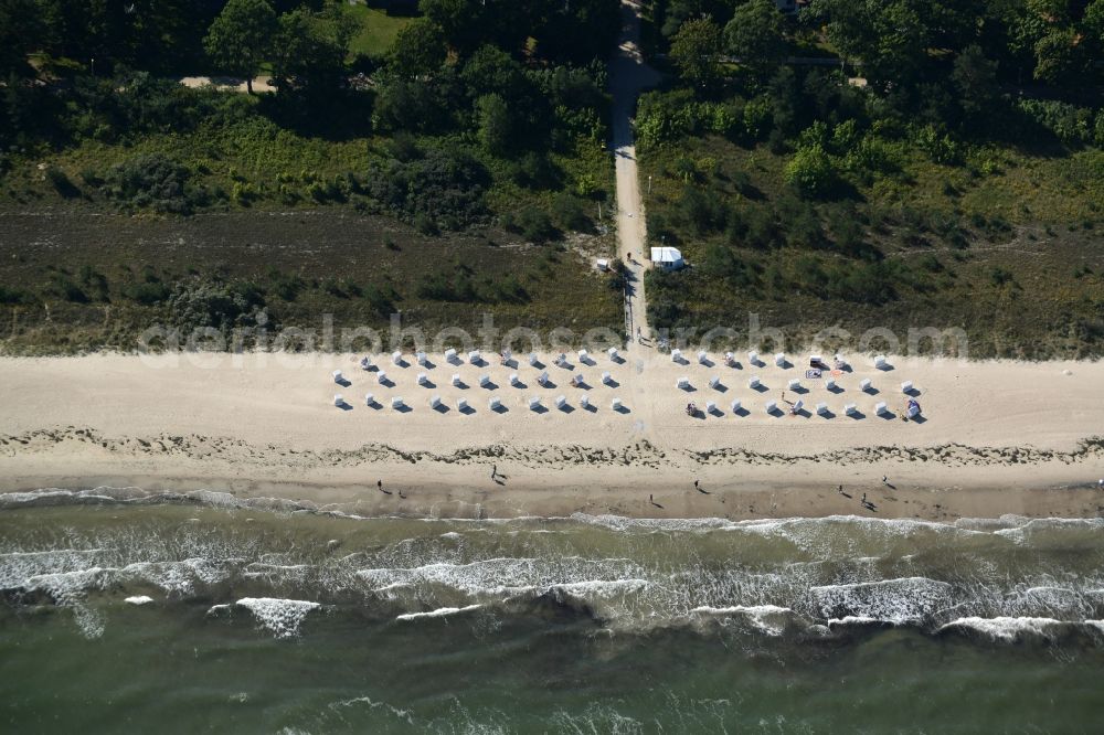 Aerial image Ostseebad Boltenhagen - Beach chair on the sandy beach ranks in the coastal area at the Baltic Sea in Ostseebad Boltenhagen in the state Mecklenburg - Western Pomerania