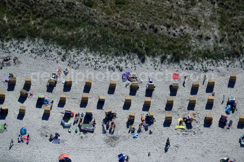 Wustrow from the bird's eye view: Beach chair on the sandy beach ranks in the coastal area of Wustrow in the state of Mecklenburg - Western Pomerania