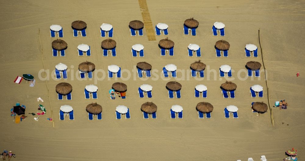 Canet-en-Roussillon from above - Beach lying places and umbrella on the sandy beach landscape of Canet-en-Roussillon on the Mediterranean coast in France. Use not permitted in personal rights affecting Zoom cutouts!