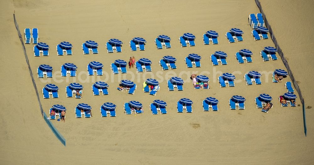 Canet-en-Roussillon from above - Beach lying places and umbrella on the sandy beach landscape of Canet-en-Roussillon on the Mediterranean coast in France. Use not permitted in personal rights affecting Zoom cutouts!