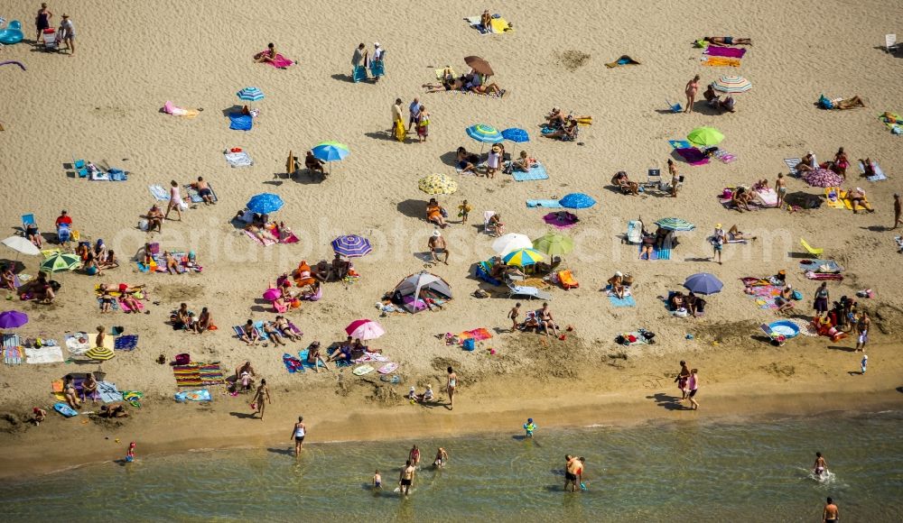 Aerial image La Grande-Motte - Beach lying places and umbrella on the sandy beach landscape of La Grande-Motte in France. Use not permitted in personal rights affecting Zoom cutouts!