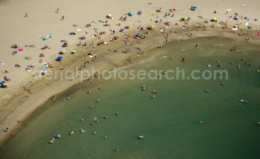 Aerial photograph Mauguio - Beach lying places and umbrella on the sandy beach landscape of Mauguio on the Mediterranean coast of the province of Languedoc-Roussillon in France