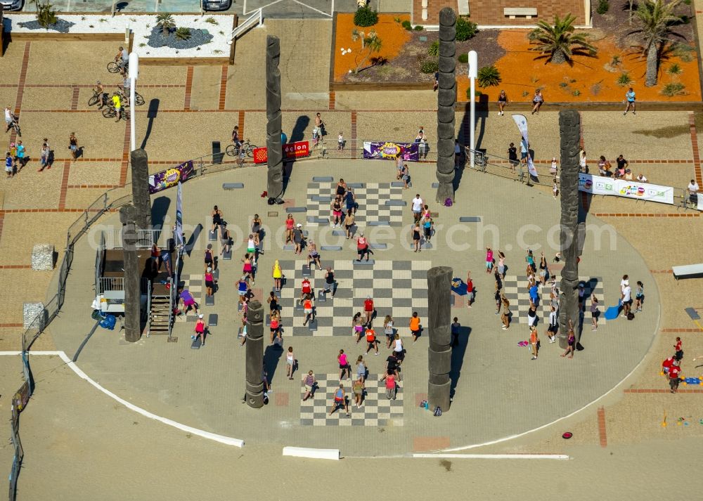 Le Barcarès from above - Beach promenade tourists in recreational sports and chess game in Le Barcarès in France