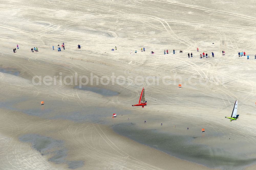 Aerial photograph Sankt Peter-Ording - View of land sailors in Sankt Peter-Ording in the state of Schleswig-Holstein, Germany. The sailors sail on the beach