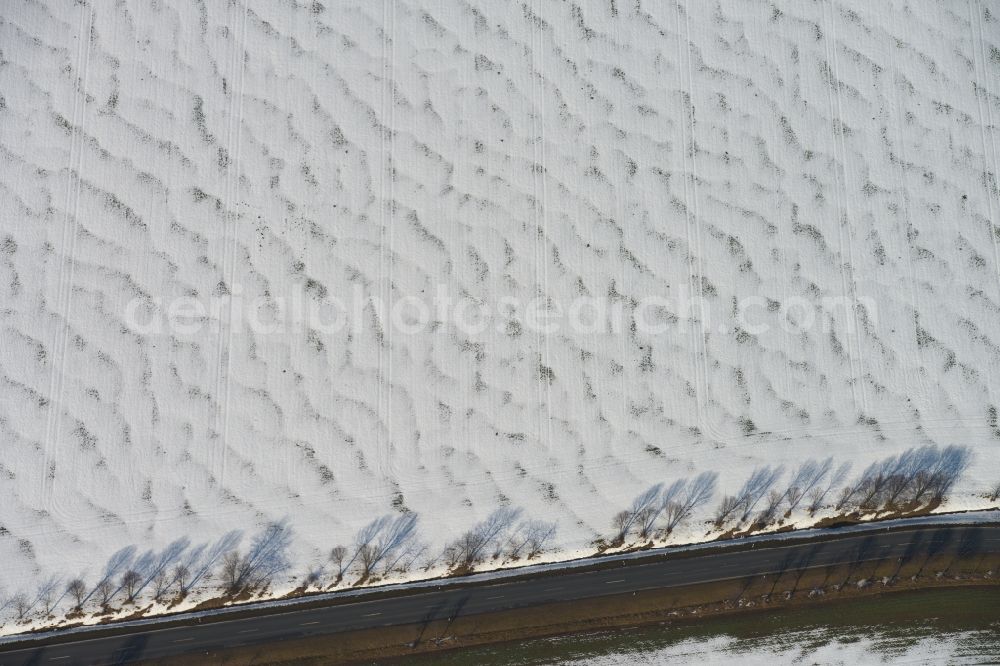 Amt Wachsenburg from above - View of a road in winter in Amt Wachsenburg in the state Thuringia