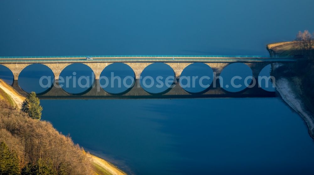 Lüdenscheid from above - Low water level and lack of water caused the shoreline areas to be exposed of Versetalsperre in Luedenscheid in the state North Rhine-Westphalia, Germany