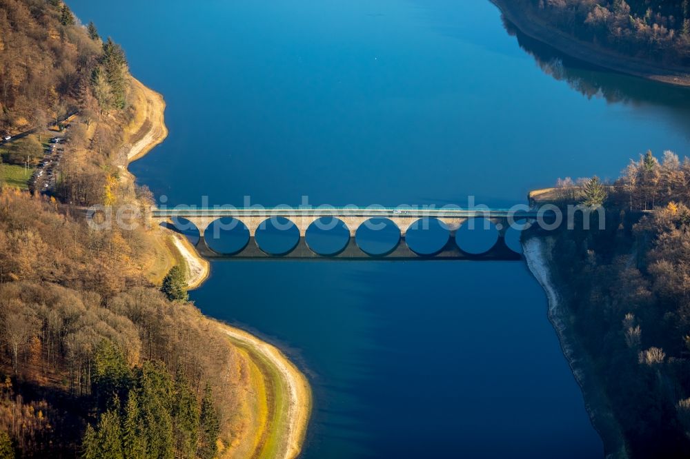 Lüdenscheid from above - Low water level and lack of water caused the shoreline areas to be exposed of Versetalsperre in Luedenscheid in the state North Rhine-Westphalia, Germany