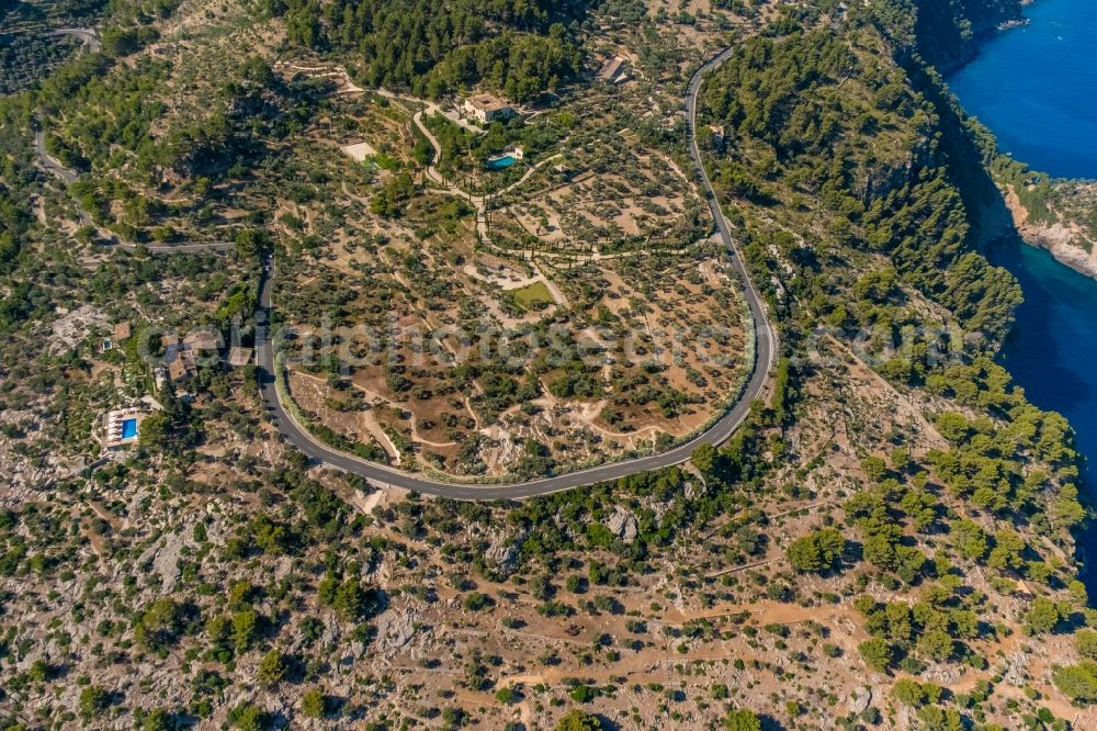 Deia from above - Street - road guidance of the Autopista Ma-10 with a curve in the shape of a loop in Deia in Balearic island of Mallorca, Spain