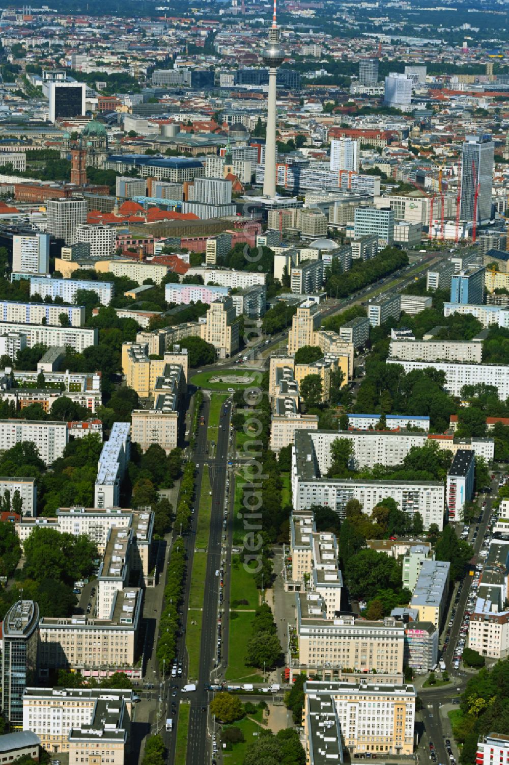 Aerial image Berlin - Street - road guidance of Karl-Marx-Allee - vormals in DDR - Zeiten auch Stalinallee genannt - zum Strausberger Platz in the district Friedrichshain in Berlin, Germany